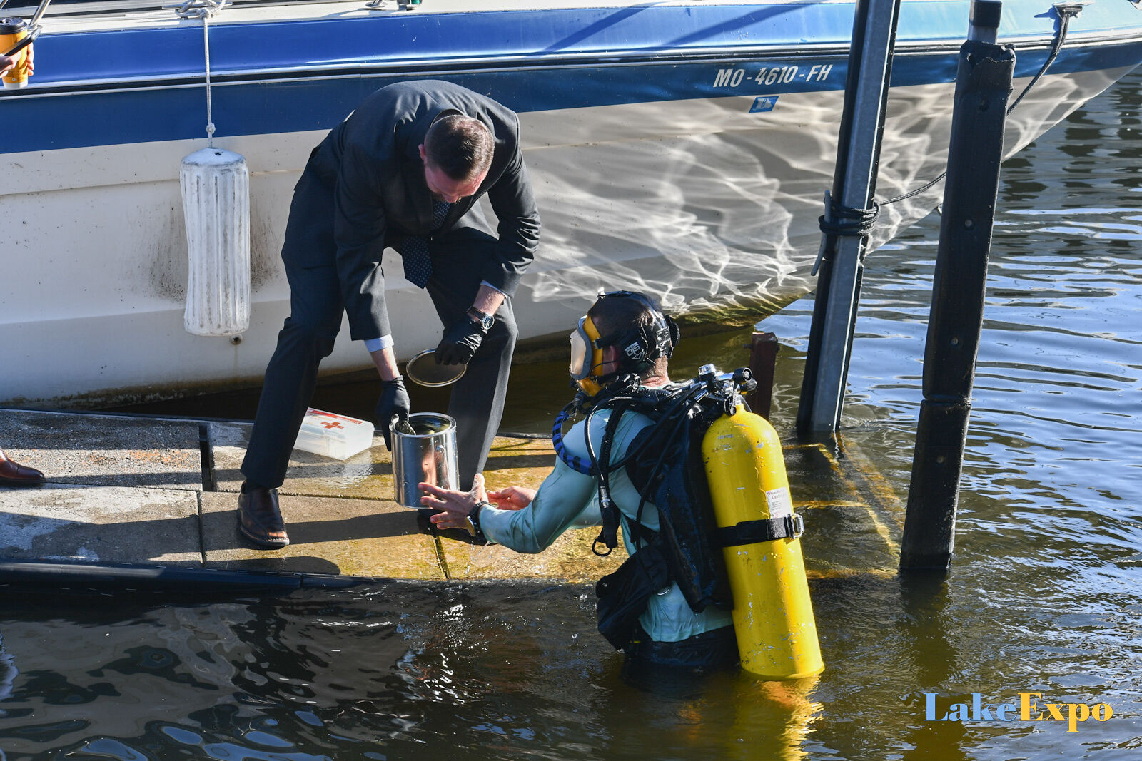 Diver Retrieves Gun From Water